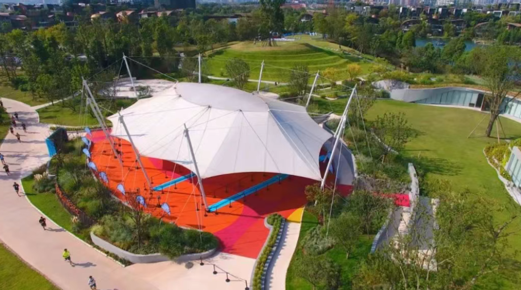 housed beneath another stretch of tensile membrane roofing